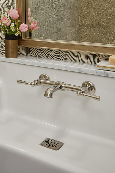 Centered by Design - Spring inspired powder room - Closeup of chrome faucet in white sink