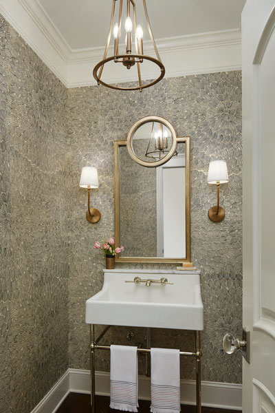 Centered by Design - Spring inspired powder room - Wide shot of full bathroom, including sink, faucet, wall sconces and pendant light