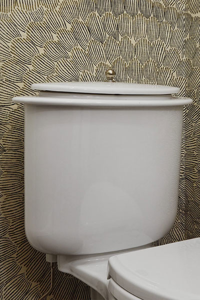 Centered by Design - Spring inspired powder room - Closeup of toilet tank with installed hardware