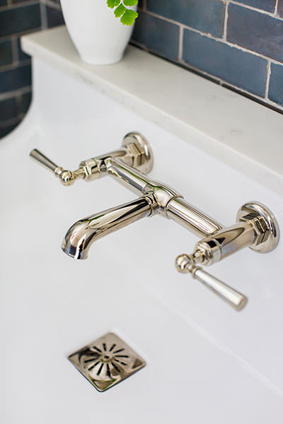 House of Jade Interiors - Winter inspired powder room - Closeup of bathroom faucet